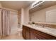 Shared bathroom with tub shower and double vanity at 3814 Royal Azalea Way, Sanford, FL 32773