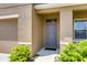 Gray front door with sidelights, landscaping, and walkway at 3814 Royal Azalea Way, Sanford, FL 32773