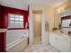 Bathroom with tub, shower, and white vanity at 412 Vista Dr, Davenport, FL 33897