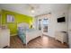 Bright bedroom with lake view, double bed, and wood floors at 412 Vista Dr, Davenport, FL 33897