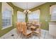 Bright dining area with a large table, and ample natural light at 412 Vista Dr, Davenport, FL 33897