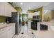 Modern kitchen with stainless steel appliances and white cabinets at 412 Vista Dr, Davenport, FL 33897