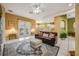 Open living space with a comfortable couch and access to a back patio at 412 Vista Dr, Davenport, FL 33897