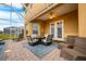 Covered patio with seating and fire pit at 412 Vista Dr, Davenport, FL 33897