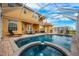 Inviting backyard oasis featuring a screened-in pool and spa at 412 Vista Dr, Davenport, FL 33897