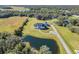 Private estate with pond, showcasing a large home with ample parking at 4510 Packard S Ave, St Cloud, FL 34772