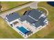 Aerial view showcasing a large home with a central pool and gazebo, surrounded by green lawns at 4510 Packard S Ave, St Cloud, FL 34772