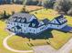 Aerial view of a sprawling home with a well-manicured lawn and paved driveway at 4510 Packard S Ave, St Cloud, FL 34772