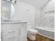 Well-appointed bathroom with a soaking tub and marble tile at 4510 Packard S Ave, St Cloud, FL 34772