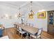 Bright dining room with a large table and unique lighting at 4510 Packard S Ave, St Cloud, FL 34772