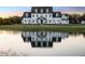Stunning home with reflection in the lake in front at 4510 Packard S Ave, St Cloud, FL 34772