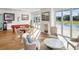 Game room features pool table, seating area, and large windows overlooking pool at 4510 Packard S Ave, St Cloud, FL 34772
