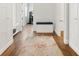 Bright hallway with built-in bench and decorative rug leading to home gym at 4510 Packard S Ave, St Cloud, FL 34772