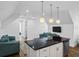 Modern kitchenette with black countertop and three pendant lights at 4510 Packard S Ave, St Cloud, FL 34772