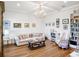 Cozy living room with comfortable furniture and bookshelves at 4510 Packard S Ave, St Cloud, FL 34772