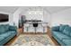 Open concept lounge area with kitchenette and comfortable seating at 4510 Packard S Ave, St Cloud, FL 34772
