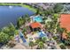 Aerial view of community pool, playground, and lake at 4732 Vero Beach Pl, Kissimmee, FL 34746