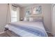 King-size bed, striped bedding, and closet at 4732 Vero Beach Pl, Kissimmee, FL 34746