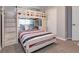 Bedroom with a built-in bunk bed and full-size bed at 4732 Vero Beach Pl, Kissimmee, FL 34746