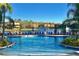 Large community pool with plenty of lounge chairs at 4732 Vero Beach Pl, Kissimmee, FL 34746