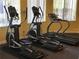Community fitness center with ellipticals and treadmill at 4732 Vero Beach Pl, Kissimmee, FL 34746