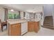 Kitchen island with sink, dishwasher, and ample storage at 4732 Vero Beach Pl, Kissimmee, FL 34746
