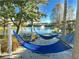 Relaxing hammocks by the lake with picnic tables at 4732 Vero Beach Pl, Kissimmee, FL 34746