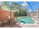 Enjoy this refreshing pool and patio area with covered seating at 4732 Vero Beach Pl, Kissimmee, FL 34746