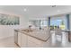 Kitchen island with granite countertop, open to dining area at 5075 Tana Ter, St Cloud, FL 34772