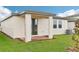 Covered patio with brick flooring and sliding glass door at 511 Kennedy Dr, Lake Alfred, FL 33850