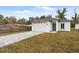 Newly built home with a paved driveway and two-car garage at 5437 Brownell St, Orlando, FL 32810