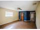 Open living area with ceiling fan, wood floors, and ample natural light at 585 Gasline Rd, Deland, FL 32724