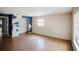 Spacious living room with wood floors, geometric paint design, and closet at 585 Gasline Rd, Deland, FL 32724