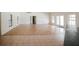 Open floor plan with hardwood and tile flooring, natural light, and seamless flow between living and kitchen spaces at 585 Gasline Rd, Deland, FL 32724