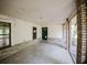 An enclosed porch featuring brick columns and accents, offering both style and protection from the elements at 585 Gasline Rd, Deland, FL 32724