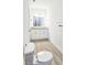 Double vanity, granite countertops, and a toilet in the bathroom at 6120 Denson Dr, Orlando, FL 32808