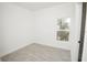 Well-lit bedroom, tile floors, and window view at 6120 Denson Dr, Orlando, FL 32808