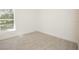 Spacious bedroom featuring tile floors and a window at 6120 Denson Dr, Orlando, FL 32808