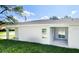Rear view of house showcasing a patio and yard at 6120 Denson Dr, Orlando, FL 32808