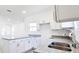 Modern kitchen featuring granite countertops and stainless steel sink at 6120 Denson Dr, Orlando, FL 32808