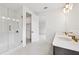 Bright bathroom with walk-in shower and dual sink vanity at 6232 Trailblaze Bnd, St Cloud, FL 34771