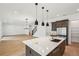 Open kitchen with marble counter tops and stainless steel appliances at 6232 Trailblaze Bnd, St Cloud, FL 34771