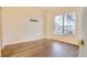 Spacious bedroom with hardwood floors and a large window at 654 Harbor Villa Ct, Clermont, FL 34711