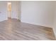Spacious bedroom with hardwood floors and access to bathroom at 654 Harbor Villa Ct, Clermont, FL 34711