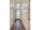 Bright entryway with hardwood floors and doors leading to other rooms at 654 Harbor Villa Ct, Clermont, FL 34711