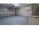 Spacious garage with ample storage and painted floor at 654 Harbor Villa Ct, Clermont, FL 34711