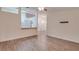 Bright living room with hardwood floors and access to kitchen at 654 Harbor Villa Ct, Clermont, FL 34711