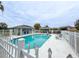 Community pool with gazebo and surrounding fence at 654 Harbor Villa Ct, Clermont, FL 34711