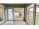 Sunroom with view of yard and access to exterior at 654 Harbor Villa Ct, Clermont, FL 34711
