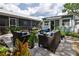 View of the backyard patio and guesthouse at 801 E 8Th Ave, New Smyrna Beach, FL 32169